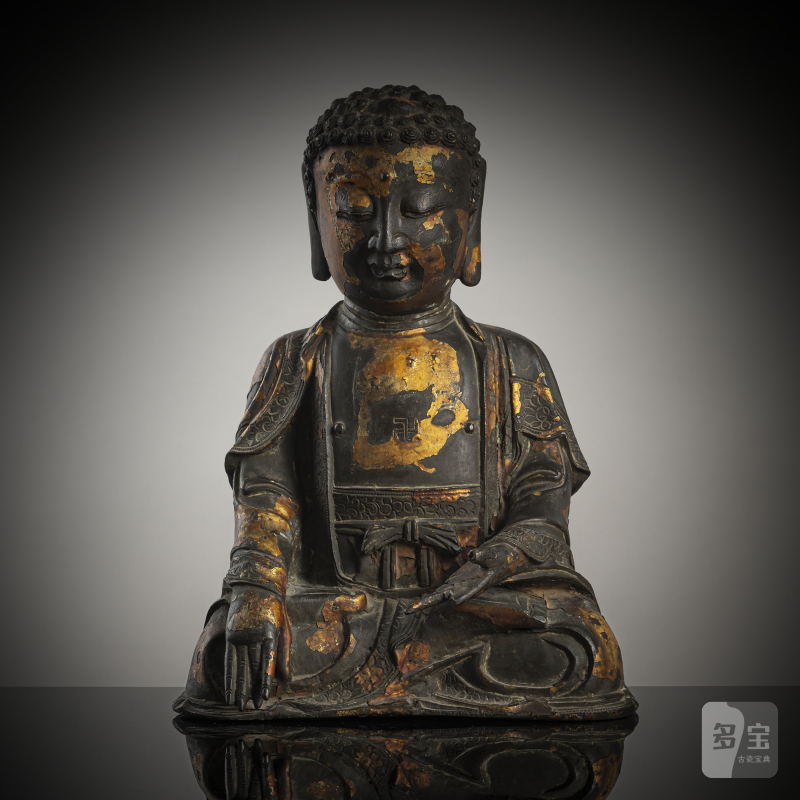 A bronze figure of seated Buddha Shakyamuni